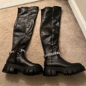 knee high black boots with chain